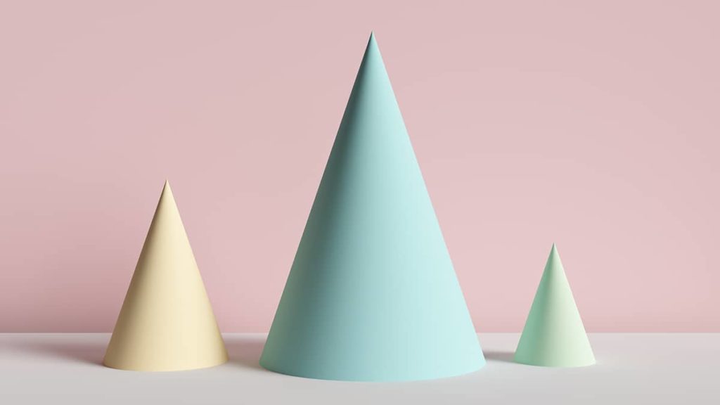 three pastel colored cones on a pink background