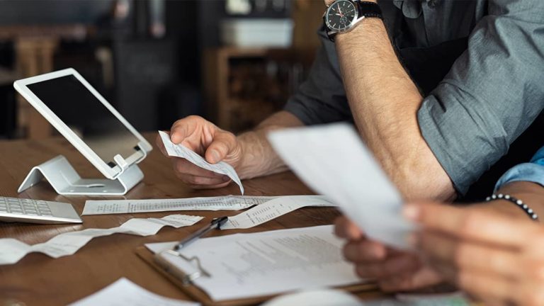 business owners looking at receipts