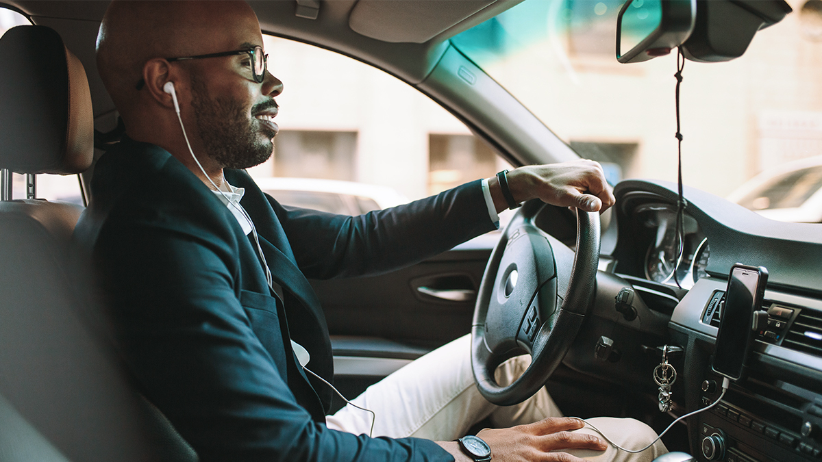 man driving to work in his car