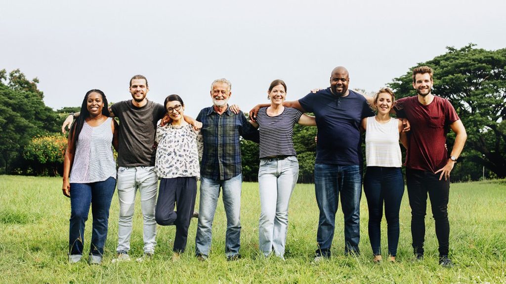 group of people standing and smiling