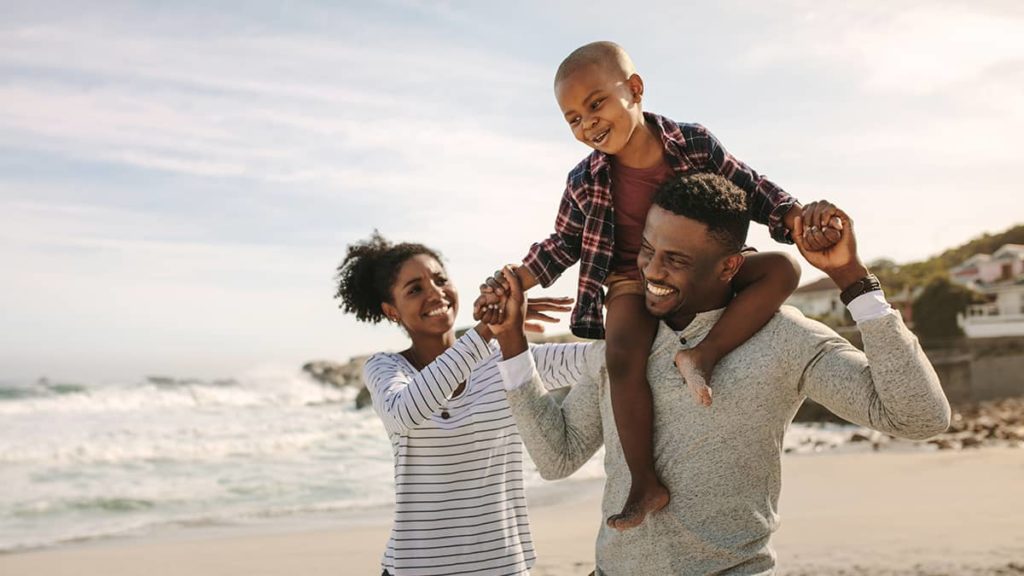 family on the beach enjoying vacation time