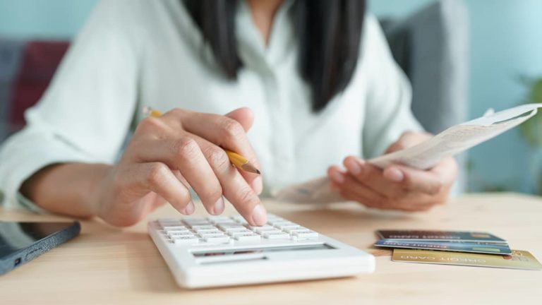 woman using calculator