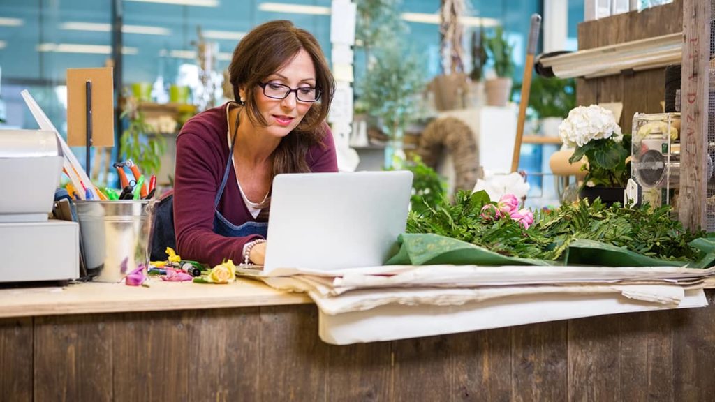 woman on computer in her small business